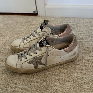 White and purple golden goose superstars